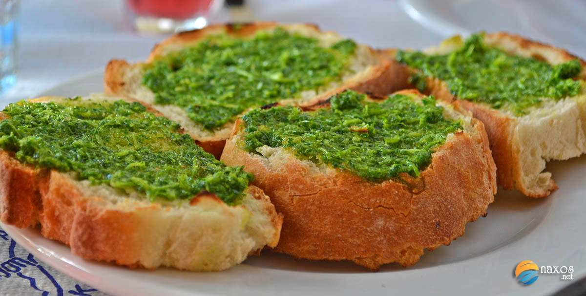 Tasty food on Naxos. Freshly baked bready with parsley and garlic pesto.