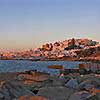 Distant view of Naxos Town at sunset