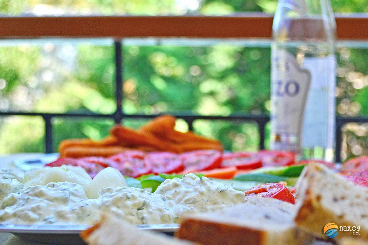 Tzatziki in a large meze dish accompanied with ouzo